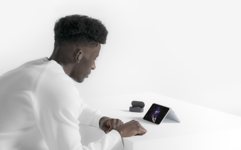 Young man using the Surface Duo