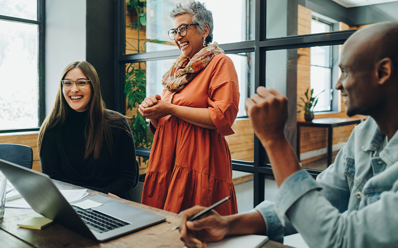 Group of colleagues smiling during a meeting
