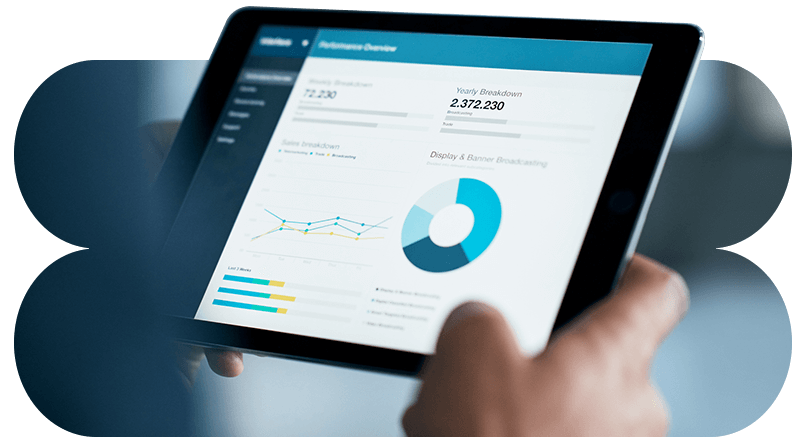 Close-up image of a business professional using a data and analytics dashboard on their tablet computer.