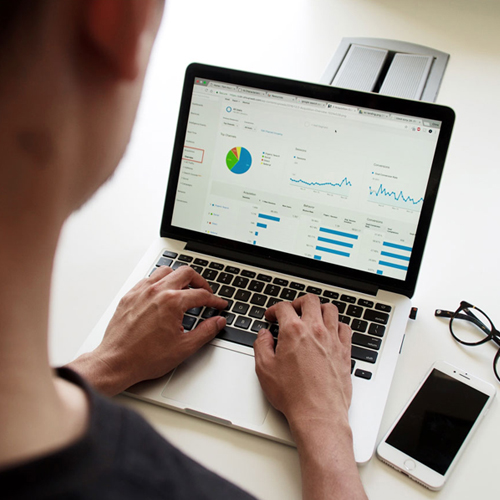 IT Director looking at tablet showing successful cloud migration adoption statistics and growth