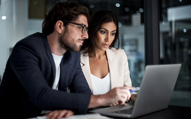 Two people collaborating at a desk