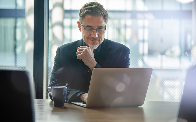 Man working on a laptop remotely