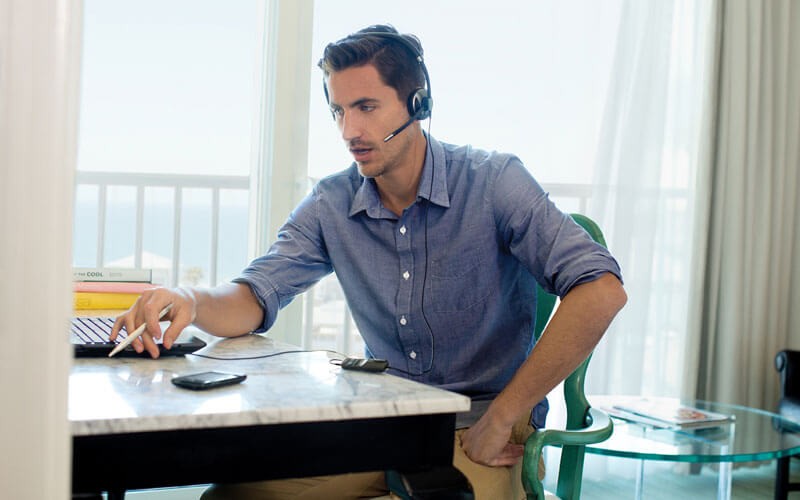 Man using corded Poly headset