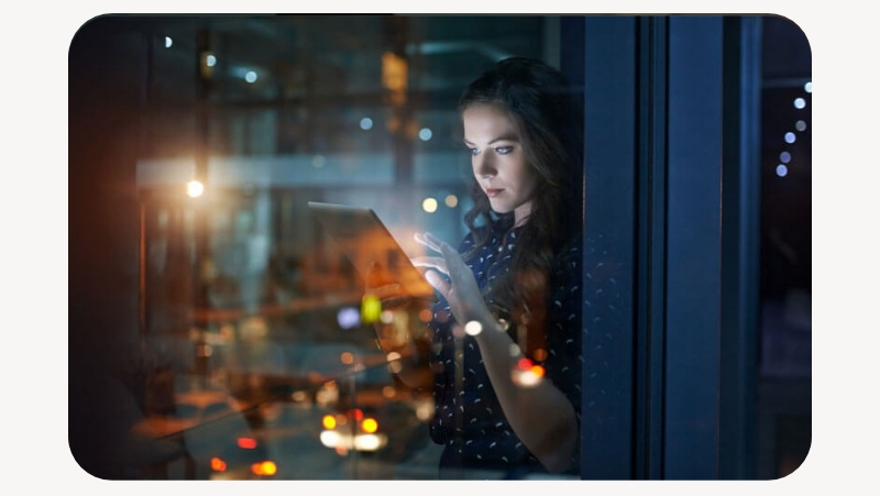 woman typing on ipad