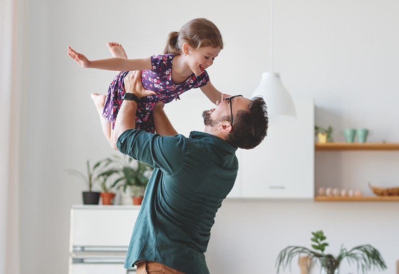 father enjoying time with his daughter