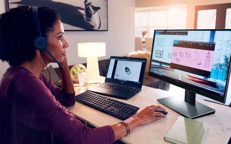 Woman working on a dell device