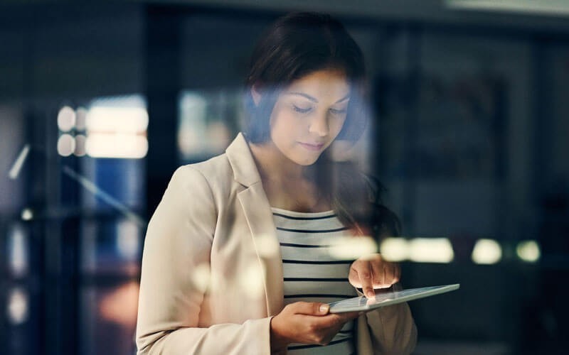 Woman using tablet device
