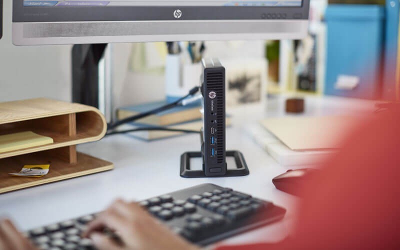 Business woman using HP desktop mini PCs