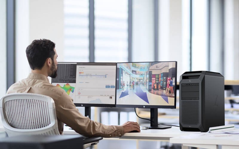 Business man working on HP monitor and workstation