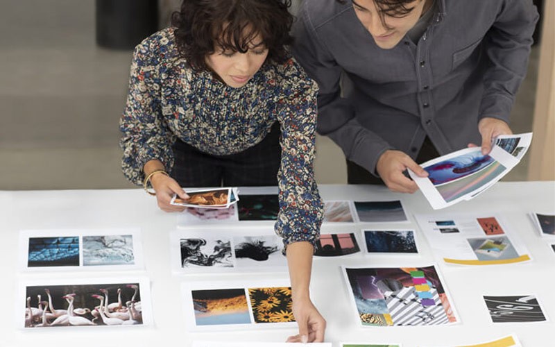 Two colleagues working together with documents