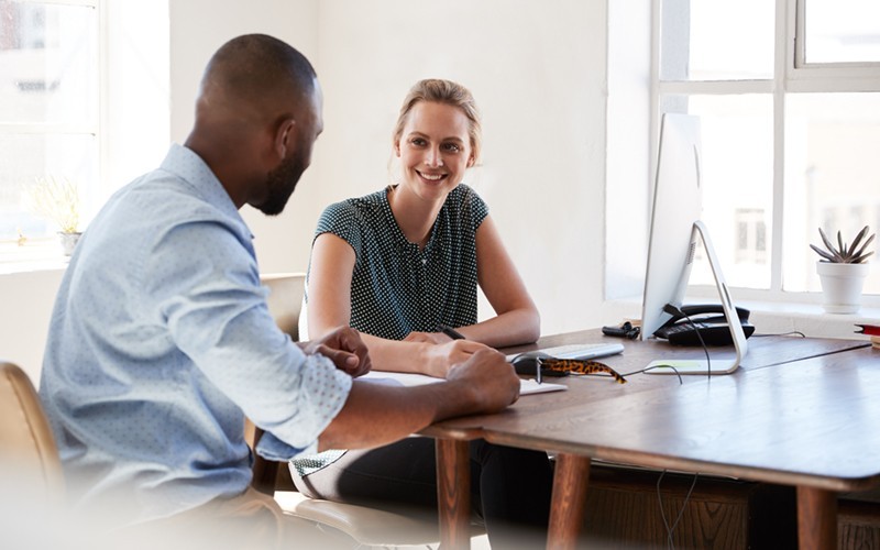 Power every aspect of your businesses Business professionals review data on a tablet computer