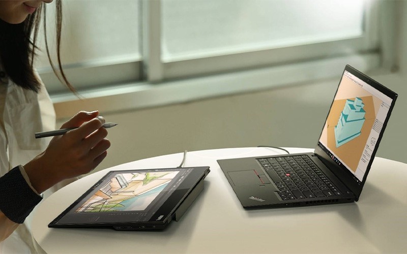 woman working on a ThinkPad device