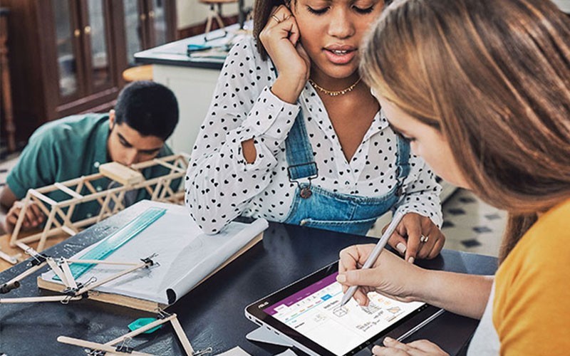 Three students working on project