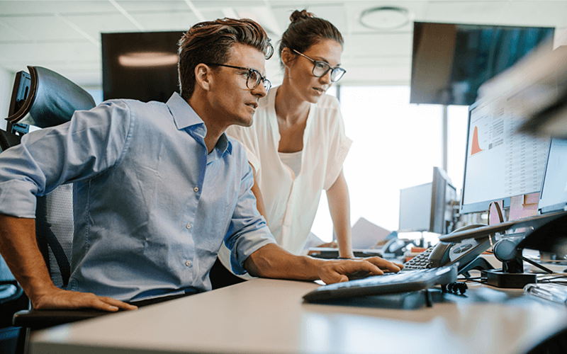 Two employees working together